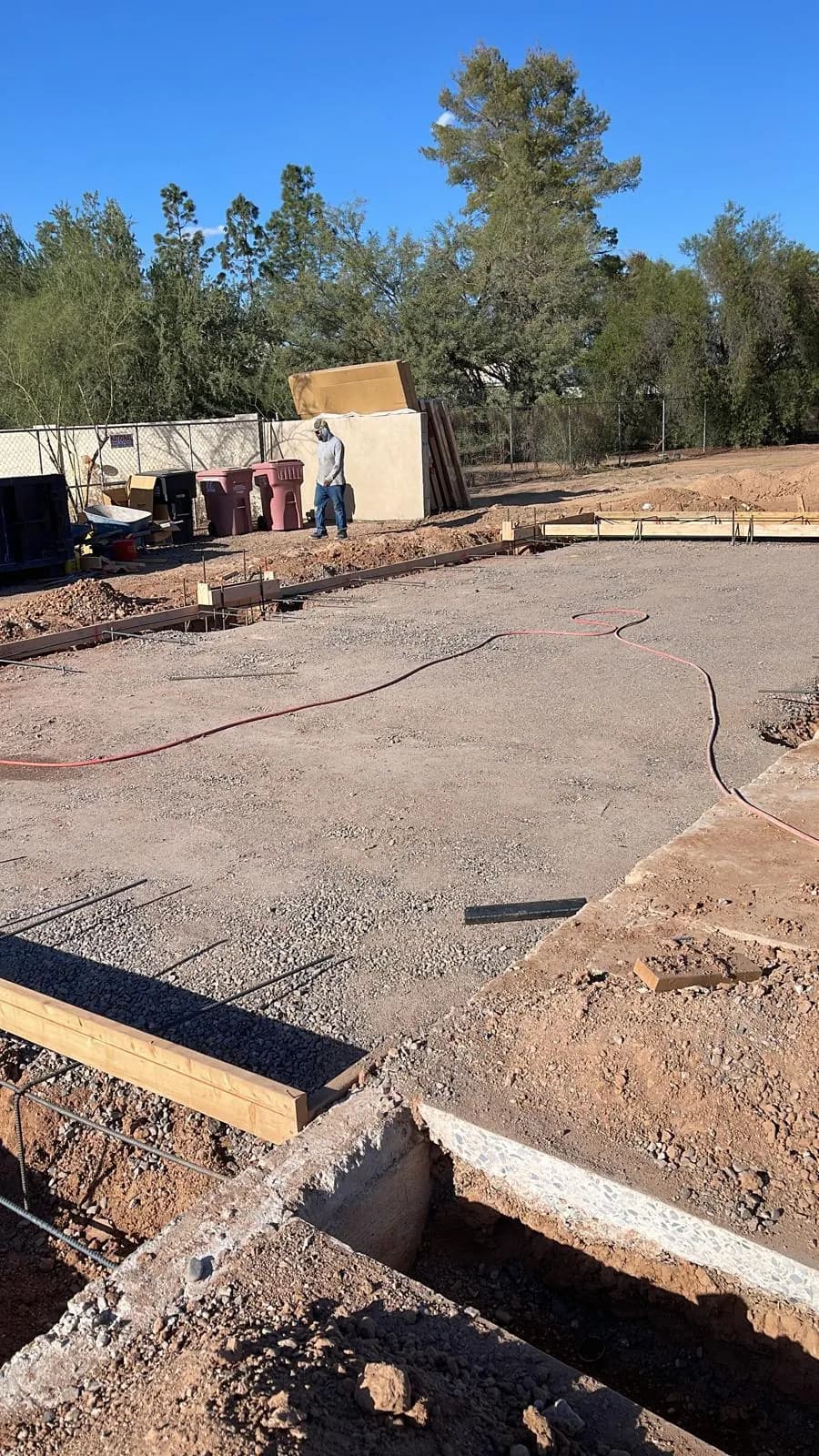 Wood forms and excavated footing trenches prepared on a job site